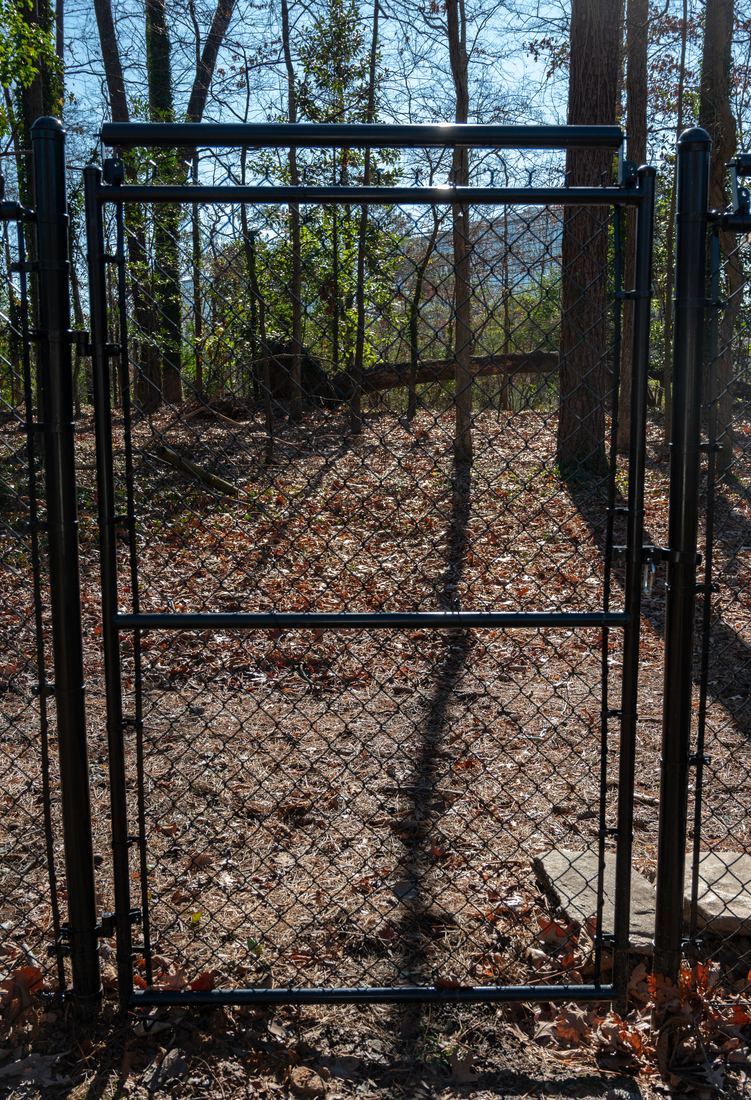 Black chain link gate coyote rollers
