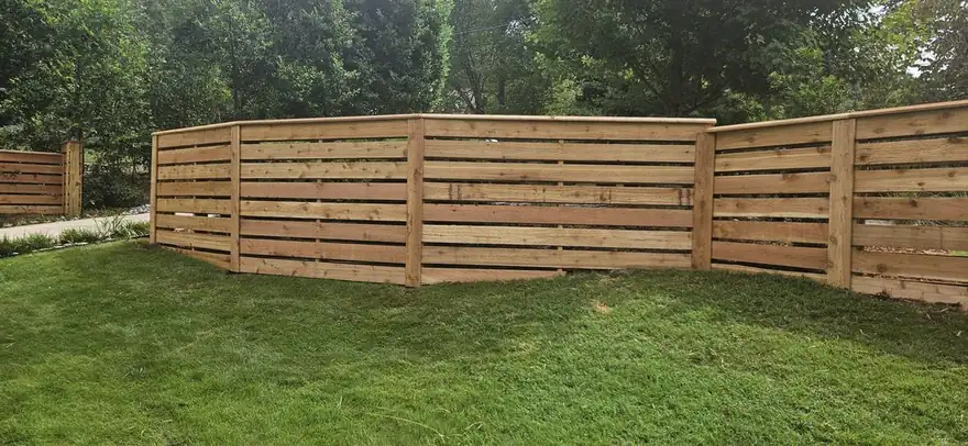 Stair-stepped horizontal cedar privacy fence installed in Decatur, GA