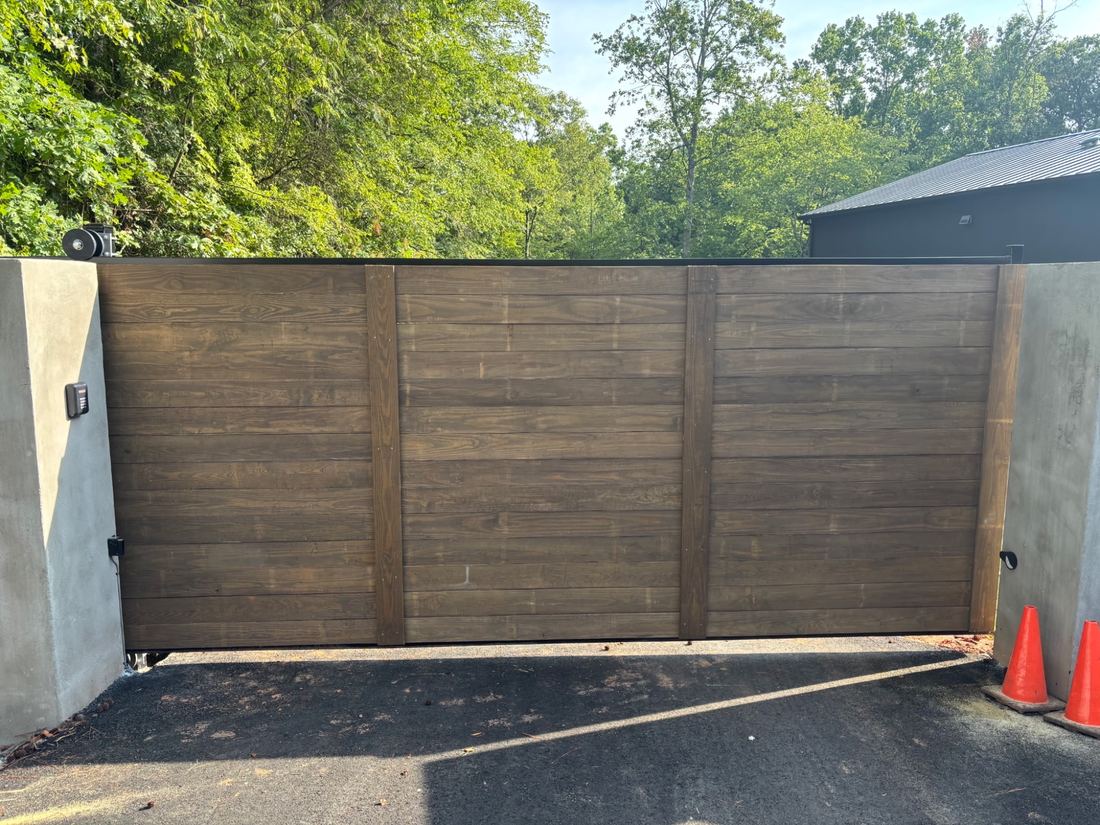 Commercial automated cantilever gate, steel frame with horizontal wood front