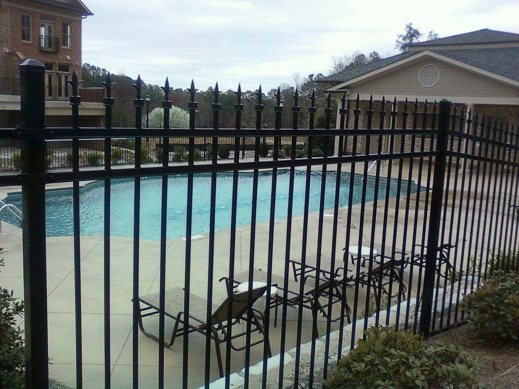 Black steel fence with ornamental finials at a Brookhaven, GA property, installed by FenceWorks of Georgia