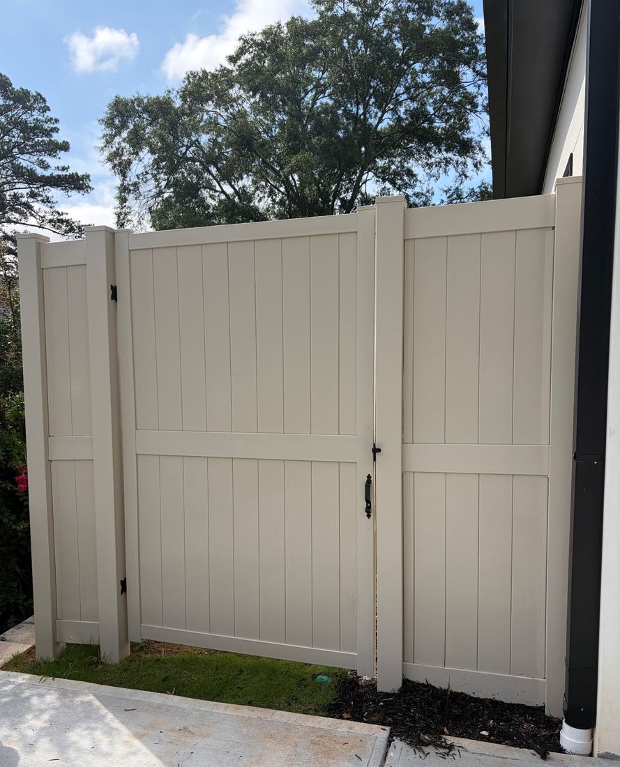Tan vinyl fence and gate, 8 ft
