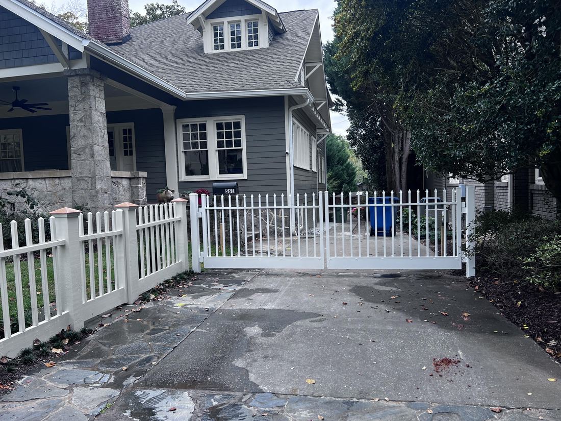White aluminum driveway gate