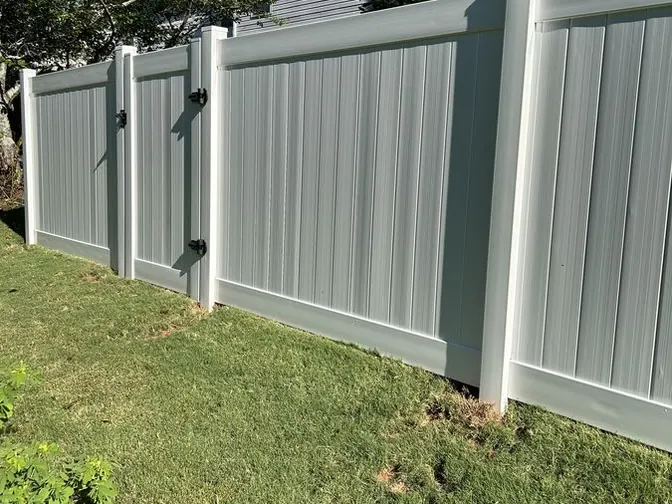 Sage vinyl privacy fence with a walk gate