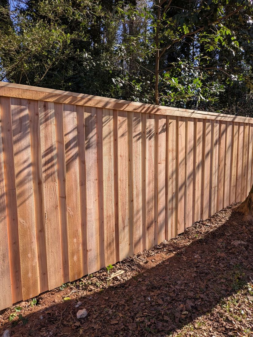 Wood board on board capped privacy