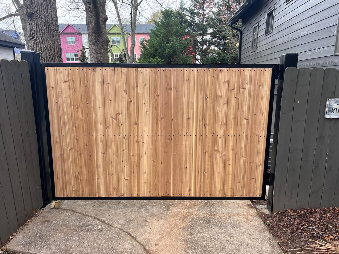 Wood cedar driveway gate with steel box frame