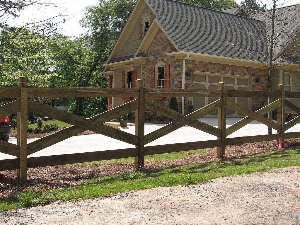 Wood crossbuck rail fence with dado posts
