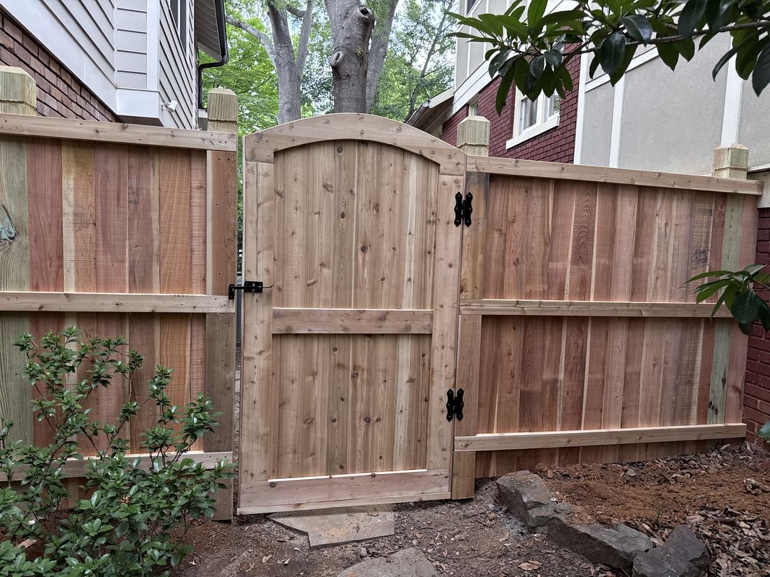 Custom arched cedar wood walk gate