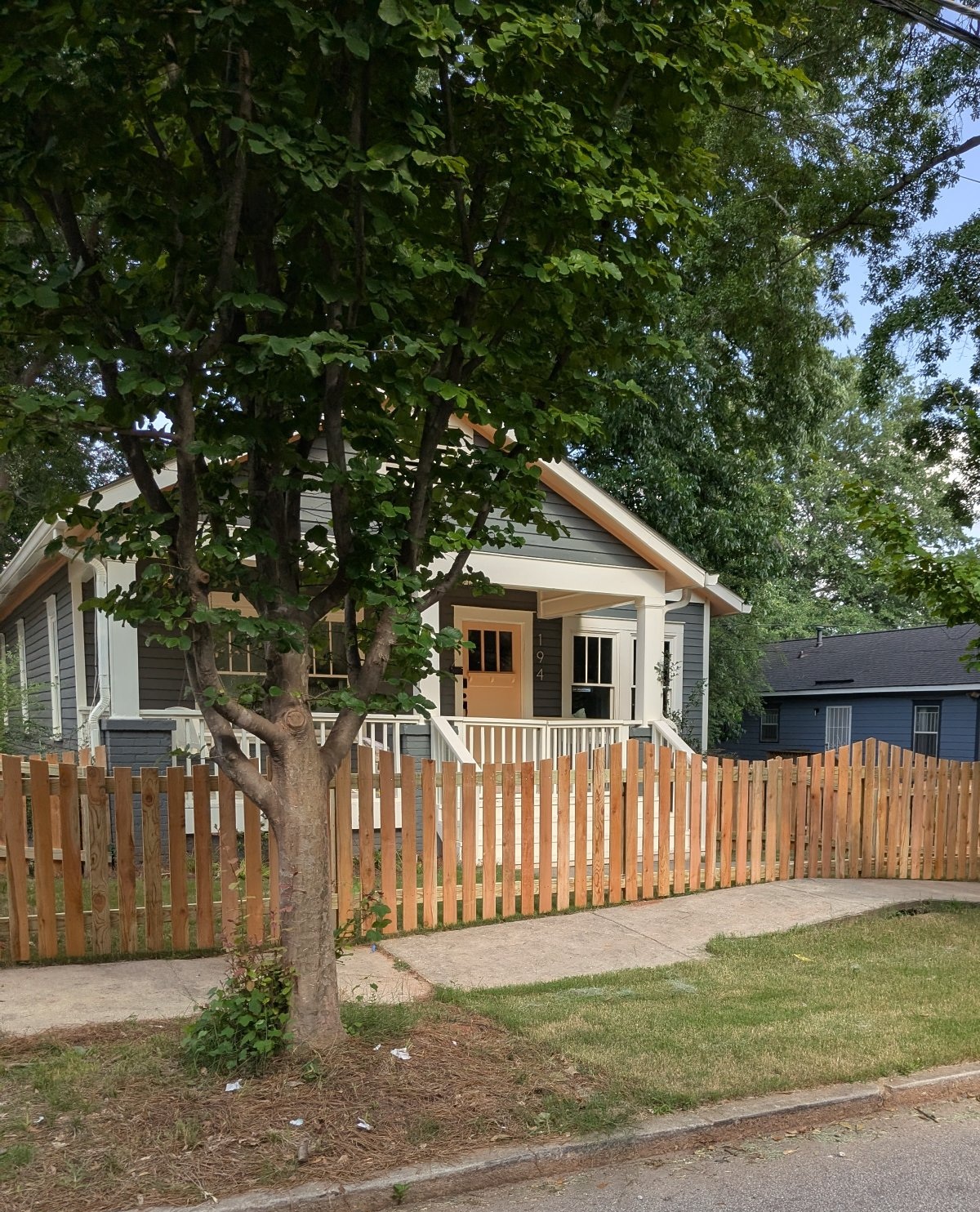 Negative scallop cedar picket fence, 4 ft front yard