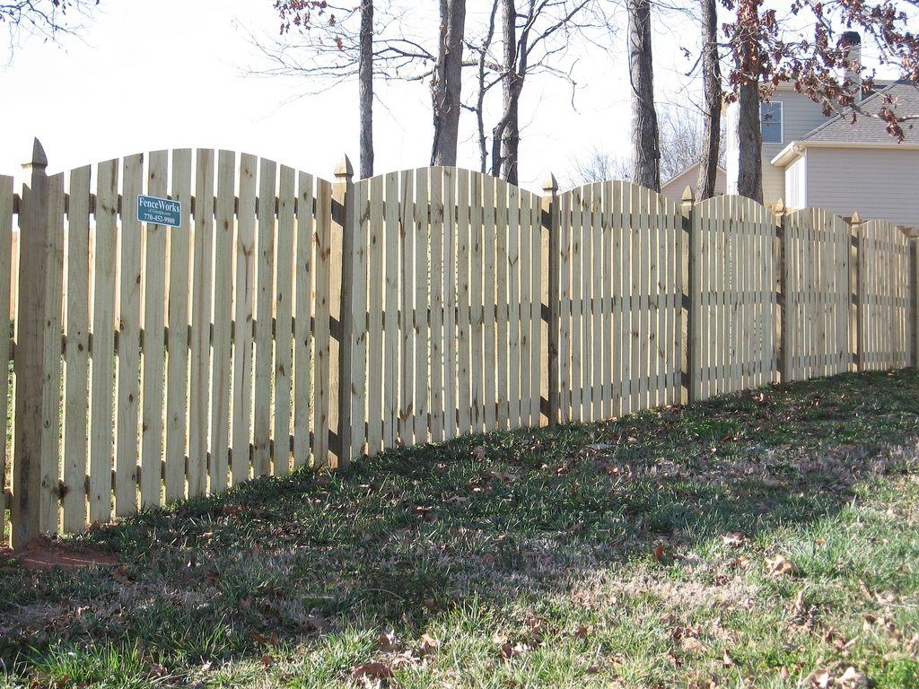 Wood pine scalloped spaced privacy fence