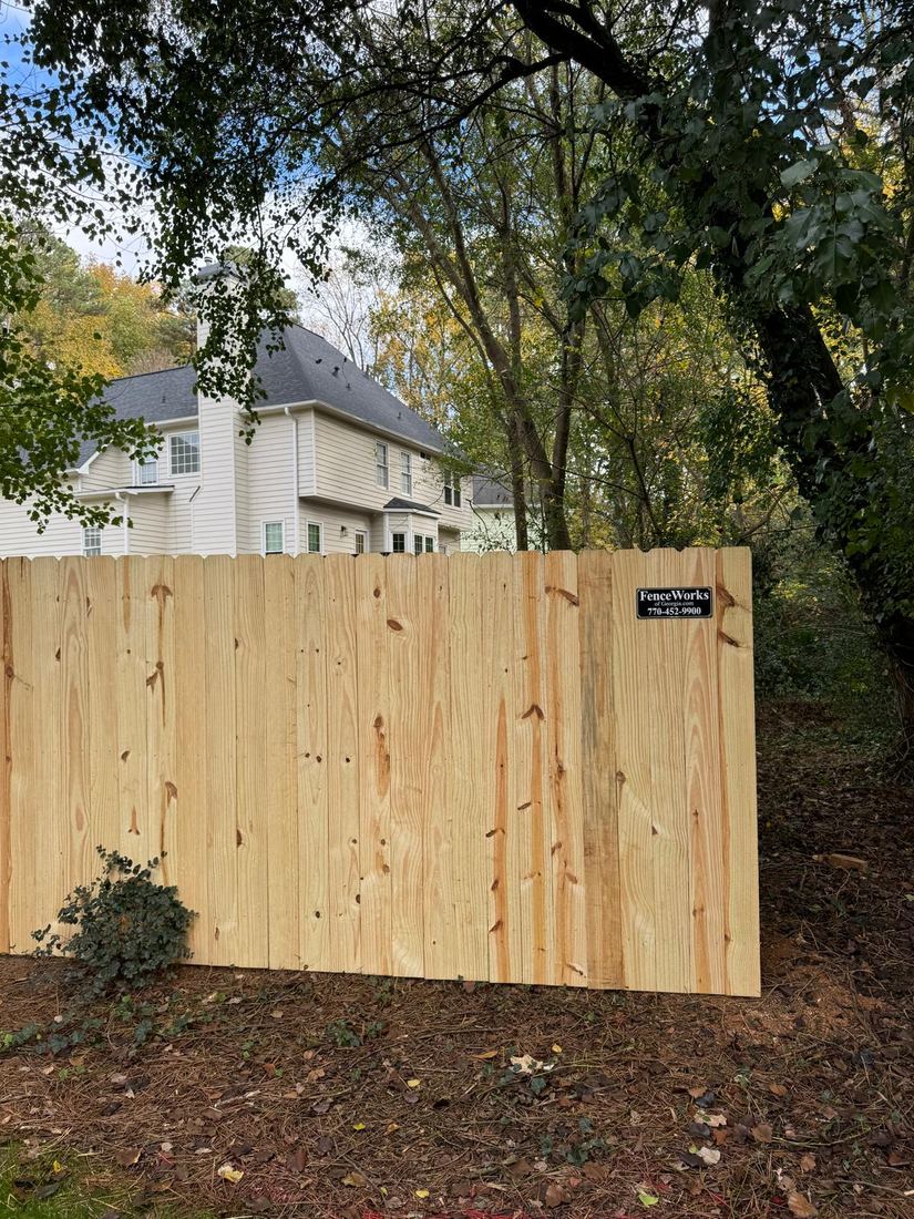 Wood privacy fence in a backyard